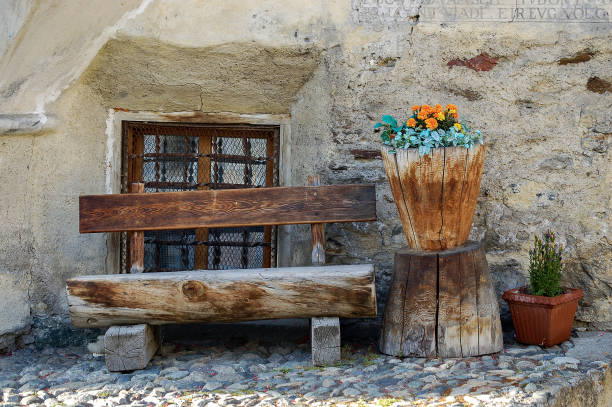 istock Wooden bench made of tree trunks - Engadin valley Switzerland 1255402852