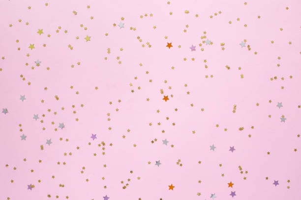 istock Golden stars shaped confetti glitter 1255404300