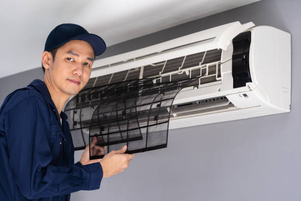 istock technician service removing air filter of air conditioner for cleaning 1255408047