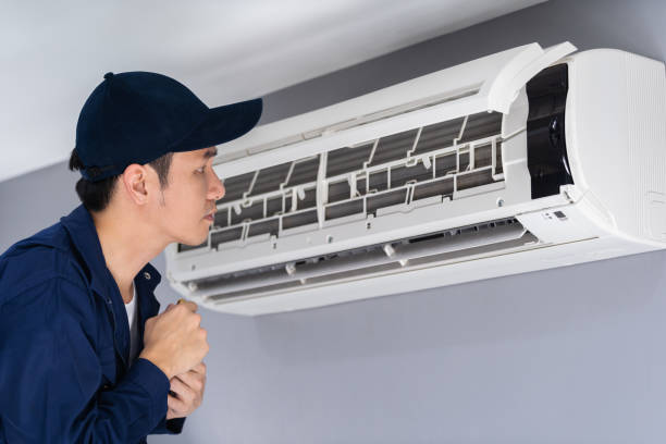 istock technician service checking and repairing air conditioner 1255408055