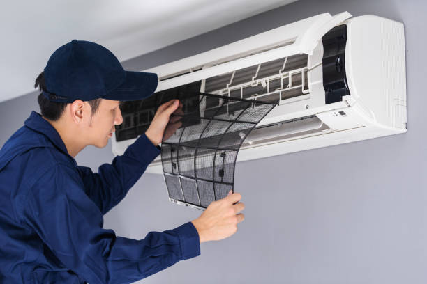 istock technician service removing air filter of air conditioner for cleaning 1255408062