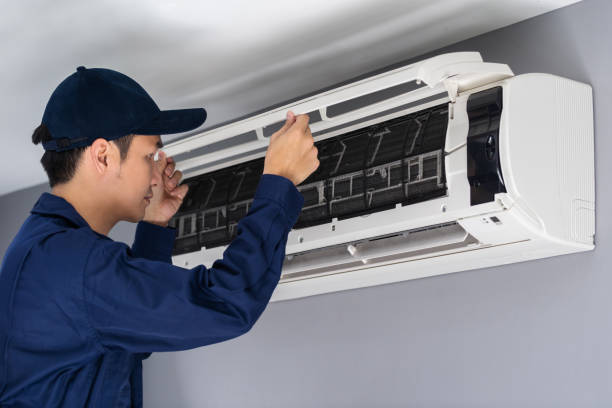 istock technician service checking and repairing air conditioner 1255408064