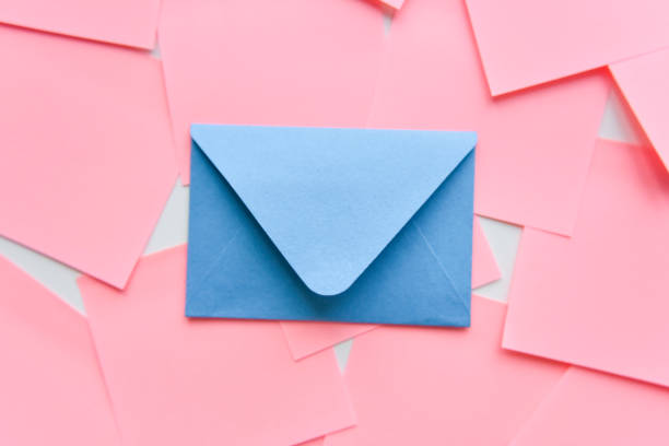 istock selective focus, classic blue envelope on the background of coral stickers 1255409227