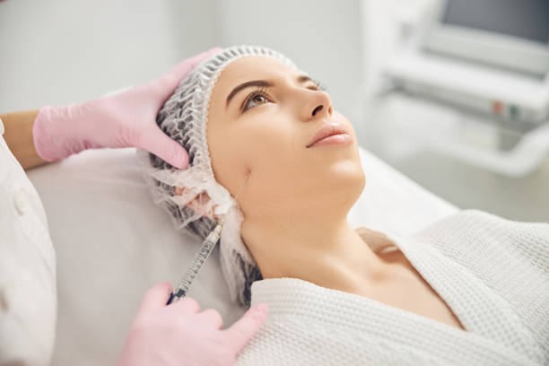 istock Application of cosmetic procedure in beauty salon 1255410178