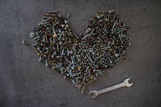 istock Heart shape made of old bolts 1255410475