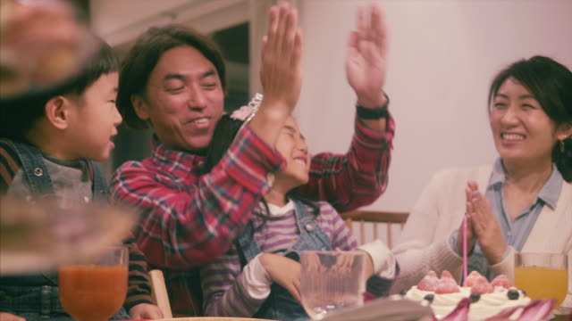 Japanese family celebrates a birthday