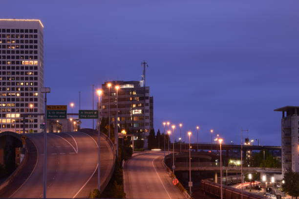 istock Highway And Overpass Going Through City With Skyscrapers Against Cloudy Dawn Sky 1255411281