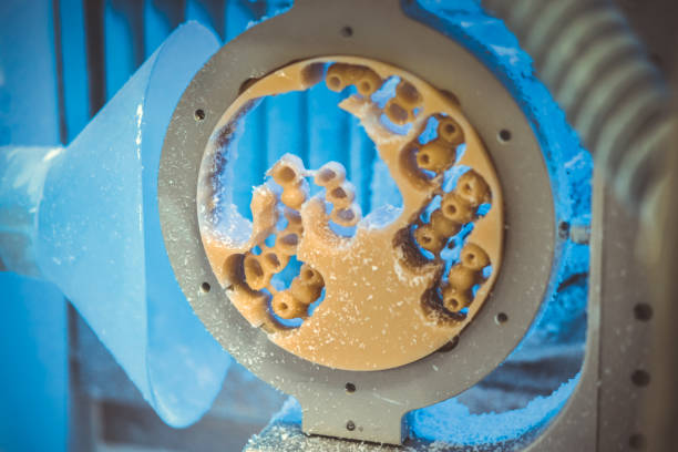 istock Dental milling machine carving out shape of human teeth 1255411529