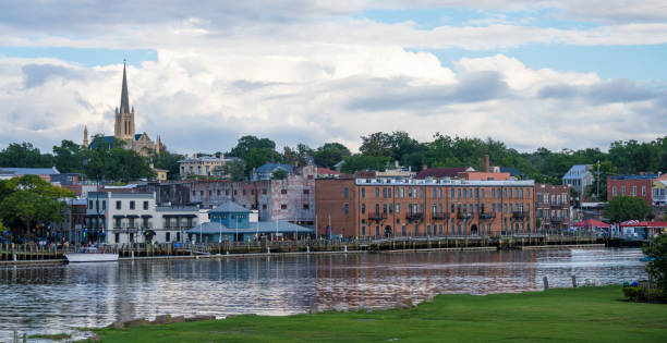 Wilmington, NC, Riverfront A view looking over the Cape Fear River at downtown Wilmington, NC, USA. cape fear stock pictures, royalty-free photos & images