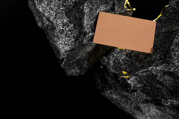 istock Business card placed between two stones 1255417515