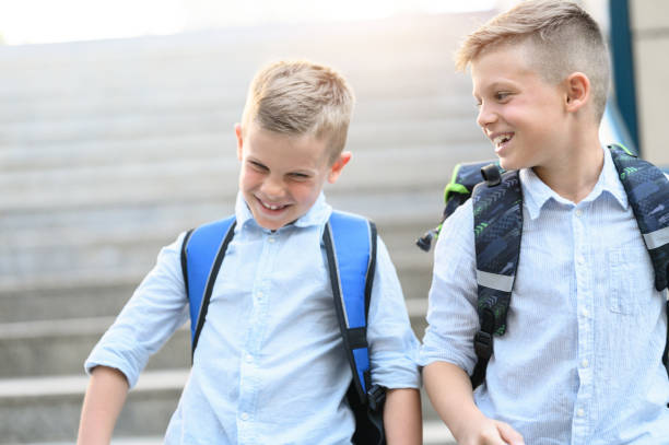 istock Happy young boys going to school. 1255418900