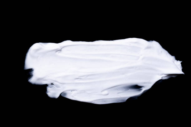 istock various strokes of shaving white cream on black background 1255419085