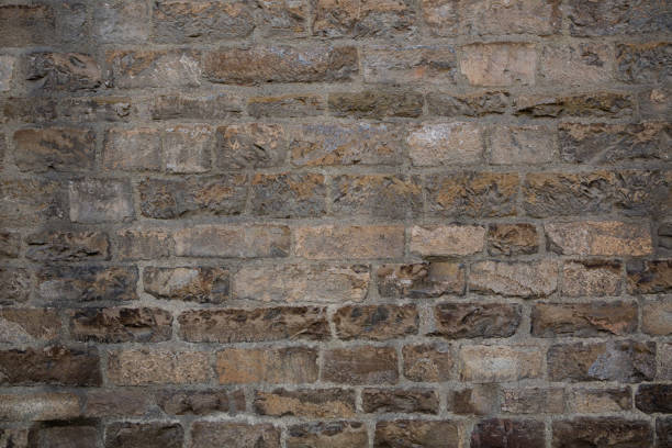 istock Antique brickwork wall. Masonry of ancient half-destroyed wall. Abstract texture or background 1255419358