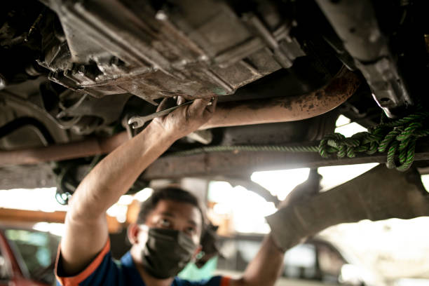 istock Technician automotive checking car in the garage 1255421601
