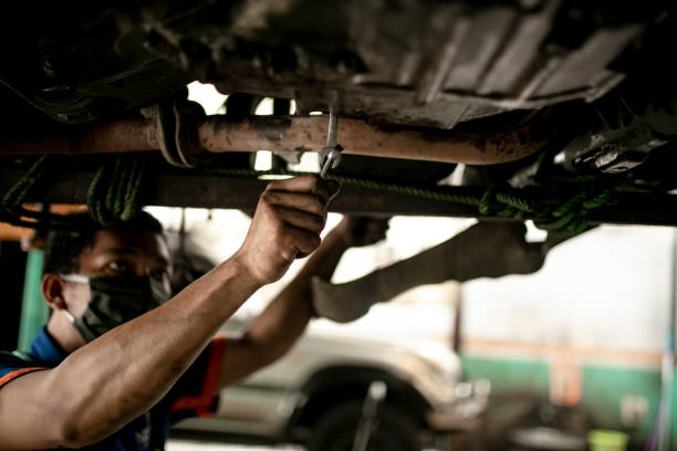 Technician automotive checking car in the garage