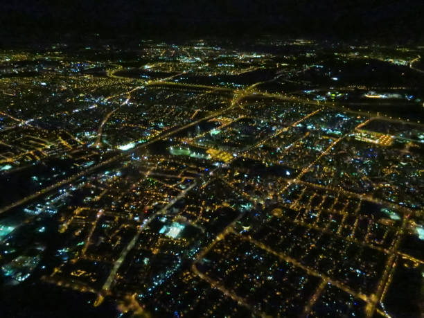 istock Night city lights illuminated; aerial view 1255422411