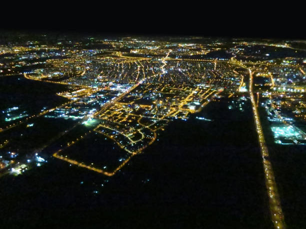 istock Night city lights illuminated; aerial view 1255422938