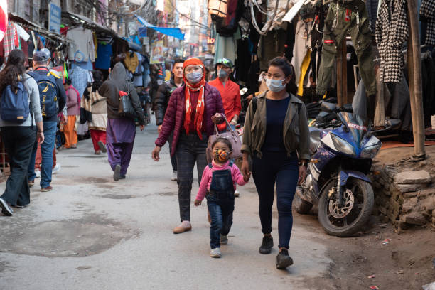 People with protecting masks  in Kathmandu  Nepal. Kathmandu, Nepal, 17 March 2020: People wearing protecting masks for protection from Covid-19 at the street market of thamel in Kathmandu Nepal Asia thamel stock pictures, royalty-free photos & images