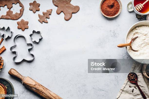 Baking Gingerbread Man Christmas Cookies In Kitchen Stock Photo - Download Image Now