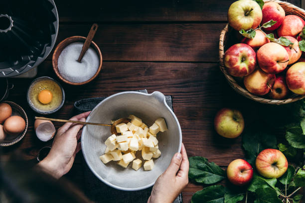 istock Woman preparing apple cake in kitchen 1255425953