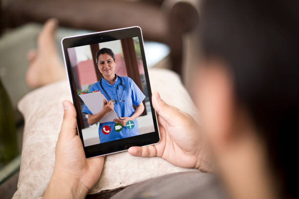 istock Man in video conference with doctor 1255427192