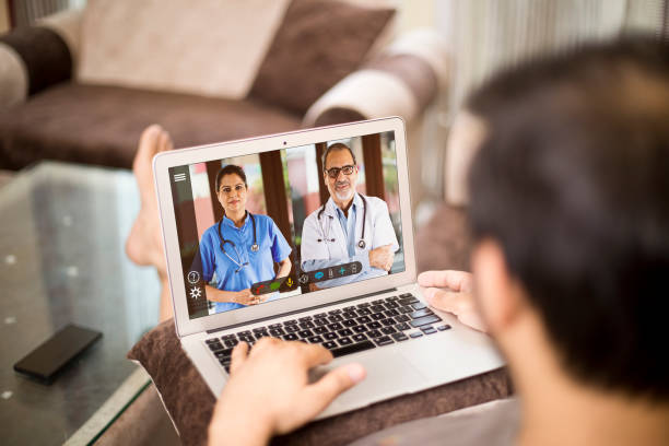 istock Man in video conference with doctor 1255427222