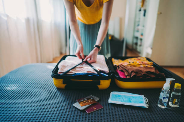 istock Packed suitcase for business travel after COVID-19 1255431878