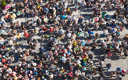 Prague, Czech Republic - June 12, 2014: Crowd of tourists gathered on the Old Town Square to watch Astronomical Clock.