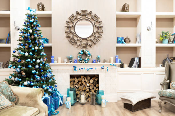 istock Beautiful new year interior with christmas tree in corner. White commode and decorated mirror on wall. Sweet home comfort 1255432917