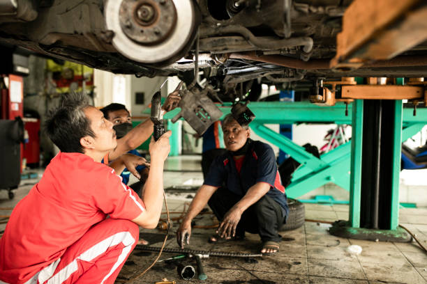 istock Technician automotive checking car in the garage 1255433495