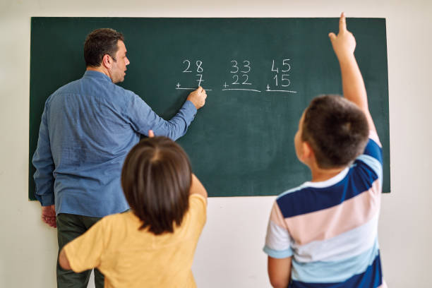 istock Children learning mathematic at classroom on school building. Education 1255433525