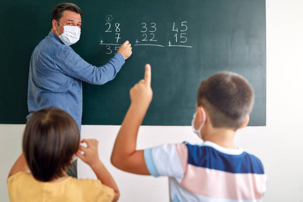 istock Children learning mathematic at classroom on school building. Education 1255433570
