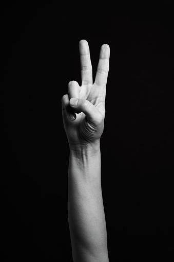 Protesting Hand On Black Background Stock Photo - Download Image Now - Peace  Sign - Gesture, Symbols Of Peace, Black Background - iStock