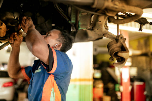 istock Technician automotive checking car in the garage 1255435140