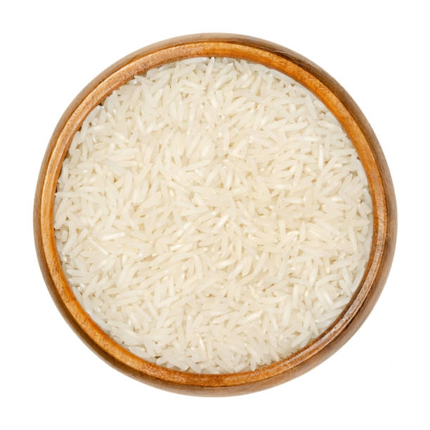 istock White Basmati rice, aromatic long grain rice in wooden bowl 1255438663