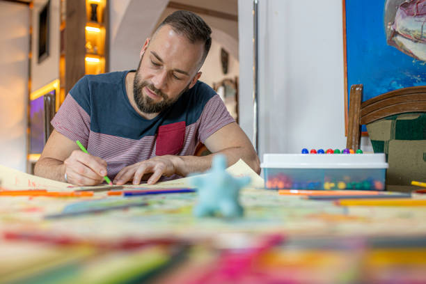 istock Father and daughters drawing and coloring at home 1255441732