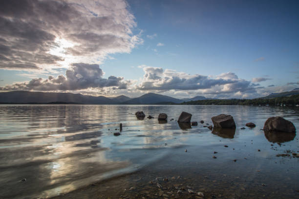 Scottish loch with rocks in the water stock photo