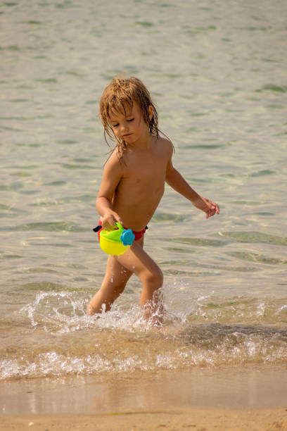 istock girl at sea 1255445391