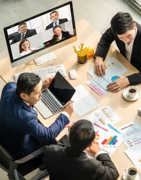 Photo of Video call group business people meeting on virtual workplace or remote office