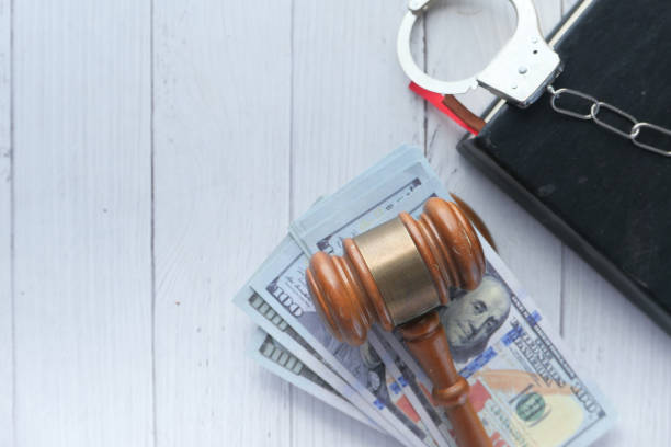 istock Gavel . hash and handcuff on table with copy space 1255446795