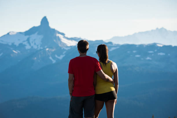 istock Couple bonding in the mountains on a summer vacation 1255448494