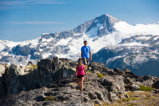 istock Couple bonding in the mountains on a summer vacation 1255448639