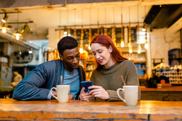 istock Diverse influencers seeking inspiration for their new content and looking for ideas on mobile phone 1255449961