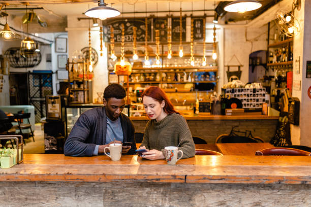 istock Hardworking journalists at the bar looking for news about protests protest to use for their article 1255449965