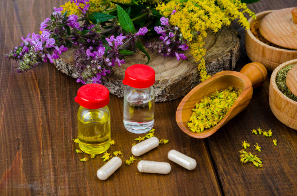 istock Pills and oil from medicinal plants. Photo 1255454047