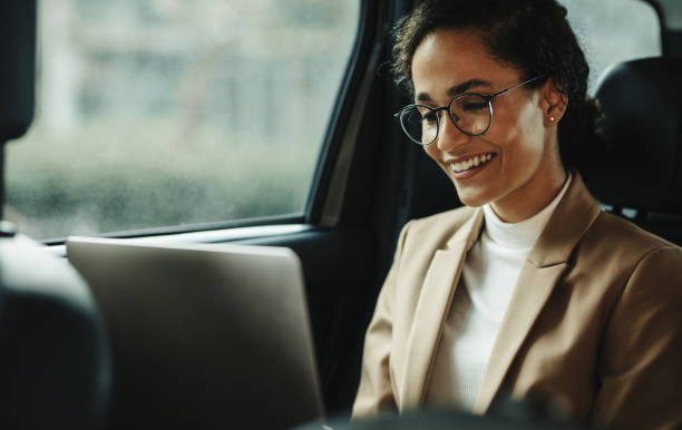 istock Businesswoman with laptop commuting to work 1255455010