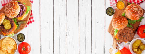 istock BBQ hamburger double border banner, top view table scene over a white wood background 1255455764