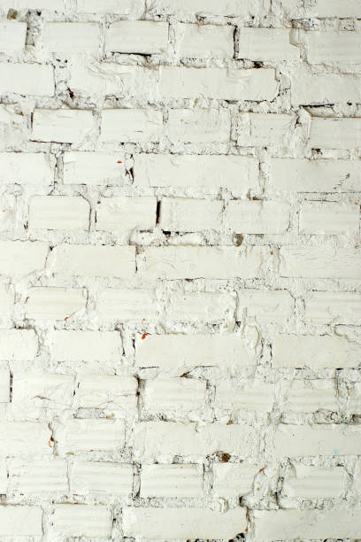 istock Old ragged white brick wall, great photophone or background 1255456539