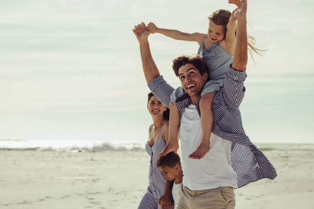istock Family having a great time on the beach 1255456815