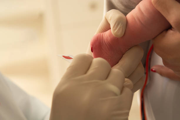 closeup of examining foot in newborn, (foot test) closeup of examining foot in newborn, (foot test) hyperglycemia stock pictures, royalty-free photos & images